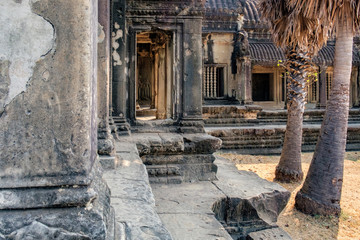 Ancient wall with frescoes and columns of ancient temple complex Angkor Wat in Siem Reap, Cambodia.