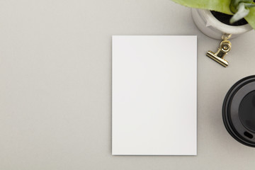 Blank white postcard flyer on a grey background