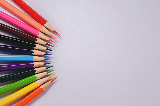 Color pencil with copy space on white background, education frame concept.