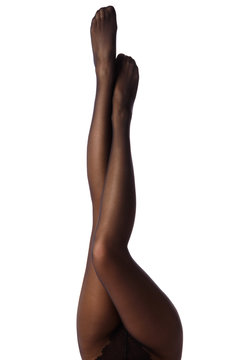 Female legs in black pantyhose