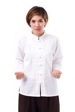 active, strong, confident asian woman practicing kungfu or tai chi quan, assuming stance