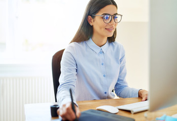 Businesswoman working with a stylus and tablet