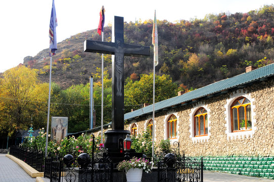 Ancient monastery. Village Saharna. Stone crucifix in orthodox monastery Saharna, Republic of Moldova.