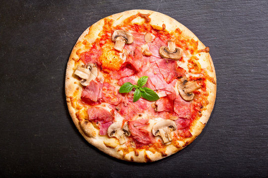 pizza with ham and vegetables