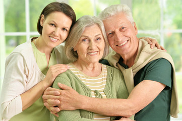 Happy senior parents with daughter