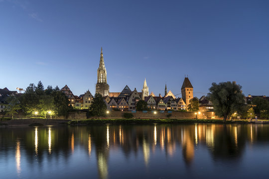 Germany, Ulm, view to the city with Danube River in the foreground at dusk