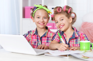 Cute  tweenie girls  with laptop