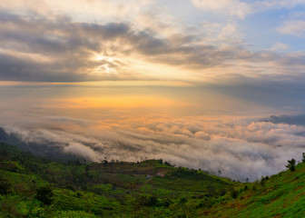 Naklejka na ściany i meble Foggy Sunrise morning in the mountains, Sunrise / Phu Tubberk National Park Phetchabun Province Asia Thailand