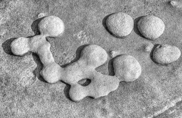 Beautiful figures on stone surface in black and white
