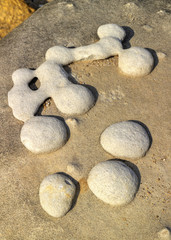 Fototapeta na wymiar Beautiful figures on stone surface closeup