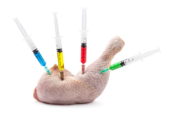 Fresh raw chicken drumstick on white background with four injections. GMO concept - 123236900