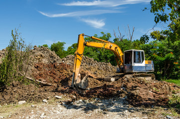 Yellow Back Hoe at construction site