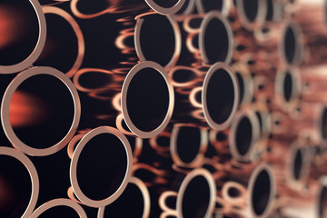Industry business production and heavy metallurgical industrial products, many shiny steel pipes, industrial background, manufacturing business production concept, copper pipes with selective focus