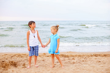 two children playing on beach