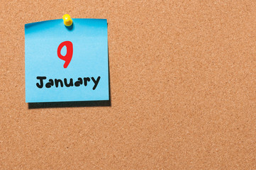 January 9th. Day 9 of month, Calendar on cork notice board. Winter time. Empty space for text