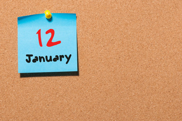 January 12th. Day 12 of month, Calendar on cork notice board. Winter time. Empty space for text