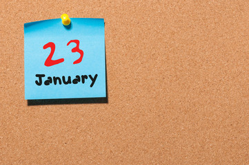 January 23rd. Day 23 of month, Calendar on cork notice board. Winter time. Empty space for text