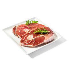 Lamb slices on plate with spice herbs