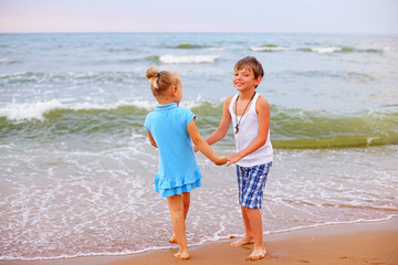 two children playing on beach