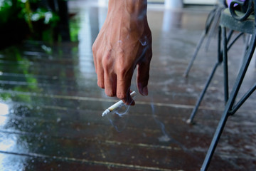 Hand Holding Cigarette While Smoking