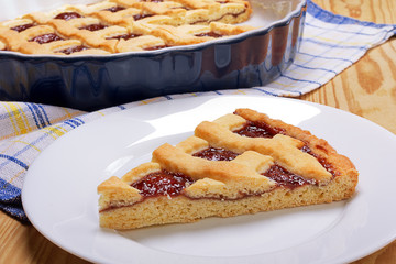 Homemade cherry pie on wooden table.