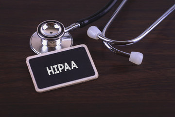 Medical Concept- HIPAA words written on label tag with Stethoscope