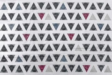 Abstract pattern of triangles on canvas.