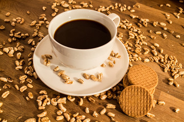 Cookies, coffee and puffed grains on the wood