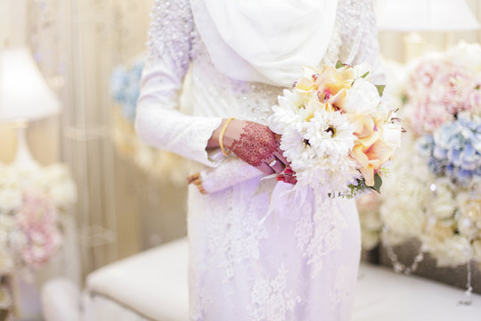 Bride with bouquet of flowers. Close up. Shallow DOF, selective