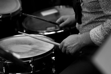 Hand girl holding a violin in the orchestra closeup in black and white