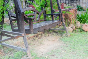 wood swing chair in the nature garden 