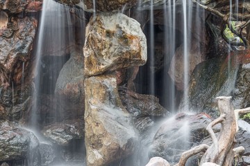 Waterfall flowing motion on stone in the garden.  Beautiful  
