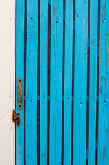 wicket door with a handle made of boards turquoise