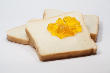 slice toast  and marmalade jam 
slice toast  and marmalade jam on a white background