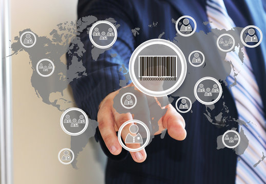 Businessman clicking on the product barcode on the touch panel with a map of the world. Web icons.