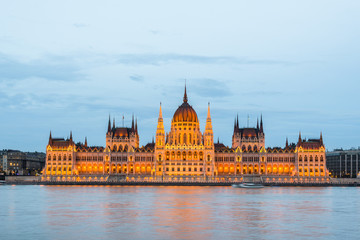 Fototapeta na wymiar Budapest Parliament at dusk on the Danube river in Hungary.