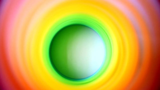 Inside of multicolor spring tunnel rippling undulating color change