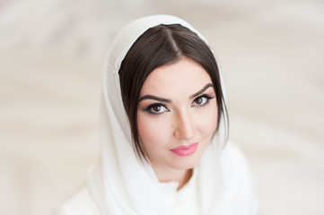 beautiful girl in hijab looks into the camera
