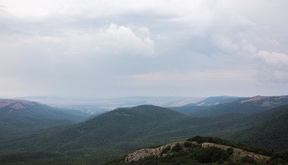Fototapeta premium Green mountains with clouds