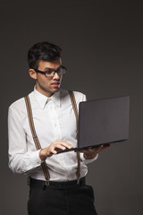happy young business man working with laptop