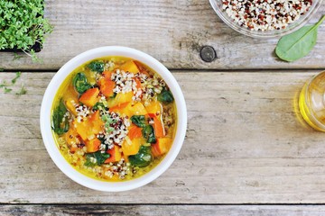 Pumpkin soup with quinoa and spinach. Superfood and clean eating concept.Selective focus