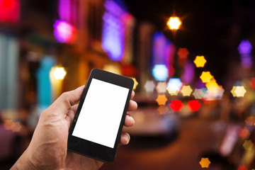 Hand man with smart phone mobile on night city