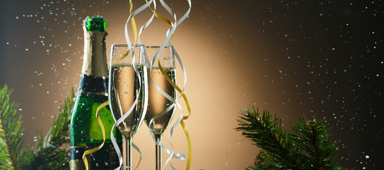 Champagne glasses decorated ribbons. Merry Christmas and happy new year