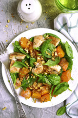 Pumpkin stew with chicken,spinach and walnuts.Top view.