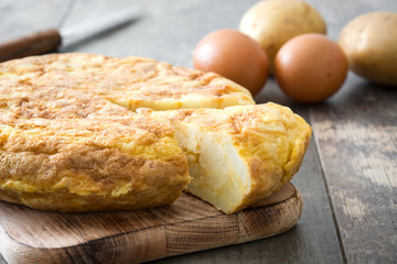 Traditional spanish omelette on rustic wooden table

