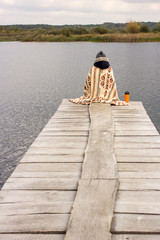 Girl wrapped in a warm blanket