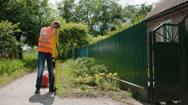 Worker prepare geodetic device for surveying