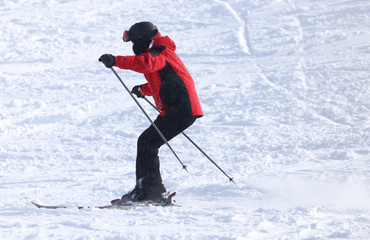 Fototapeta na wymiar people skiing in the snow in the winter