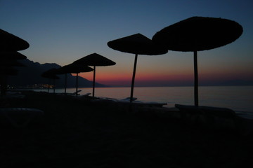 Holidays in Greece, Straw umbrellas on the beach