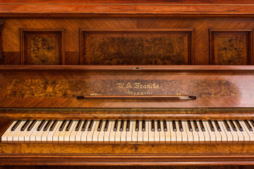 Fototapeta na wymiar Piano keys of an old German piano close up
